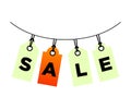 Sale signboard isolated on white background, orange labels suspended on ropes