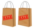 Sale signs on kraft shopping paper bags