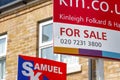 For Sale signs outside a English townhouse