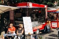 Sale of street food with a truck equipped for trade. Small business at the city fair.