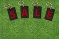 Sale Tags on Green Grass Royalty Free Stock Photo