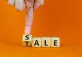 Sale or tale symbol. Businessman turns a wooden cube and changes the concept word Tale to Sale. Beautiful orange table orange