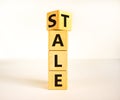 Sale or tale symbol. Turned wooden cubes and changed the concept word Tale to Sale. Beautiful white table white background, copy