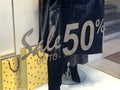 Sale text on store window display. 50% sales sign. Female shop. Female clothes Royalty Free Stock Photo