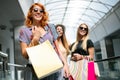 Sale and travel, happy people concept. Women with shopping bags in the ctiy Royalty Free Stock Photo