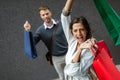 Sale, travel love consumerism and people concept. Happy couple with shopping bags in the city