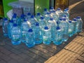 Sale of water in five-liter bottles. Hot season. Resort water. Lots of plastic bottles outside