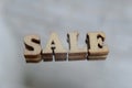 Sale wooden letters on a gray background for signs in the store