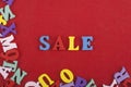 Sale word on red background composed from colorful abc alphabet block wooden letters, copy space for ad text. Learning english Royalty Free Stock Photo