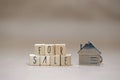 For sale written with wooden cubes, new house, real estate concept background Royalty Free Stock Photo