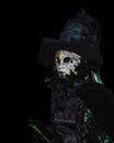 The masked woman on a dark halloween night in Salem Massachusetts