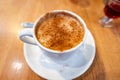 Salep with cinnamon sprinkled. Turkish Salep in cup on table, a popular winter drink in Turkey Royalty Free Stock Photo