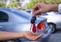 Sales agencies are selling cars and giving keys to new owners. sell car or rental car