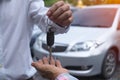 Sales agencies are selling cars and giving keys to new owners. sell car or rental car
