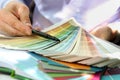 Sales agent choosing color samples for design project. Royalty Free Stock Photo