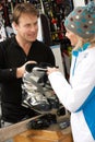 Sales Assistant Advising Customer On Ski Boots Royalty Free Stock Photo