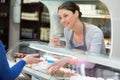 Sales assistant serving at cheese counter Royalty Free Stock Photo