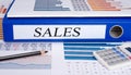 Sales binder with calculator in the office Royalty Free Stock Photo