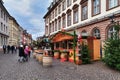 Sales booth selling goods like local liqueur during traditional Christmas market in Heidelberg city center