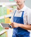 Sales clerk with tablet Royalty Free Stock Photo