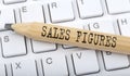 SALES FIGURES text on pencil on keyboard background Royalty Free Stock Photo
