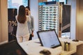 Sales lady assisting a customer in a store Royalty Free Stock Photo