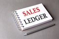 SALES LEDGER word on notebook on grey background Royalty Free Stock Photo