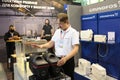 Sales promotion man presents portable pumping station made by Grundfos