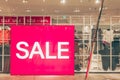 Sales promotion of women fashion clothes retail store in shopping mall, sale label sign sticker in front of shop door glasses Royalty Free Stock Photo