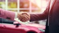 A sales representative shaking hands with an individual over a car, in the style of light crimson, poster, large canvas Royalty Free Stock Photo