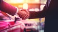 A sales representative shaking hands with an individual over a car, in the style of light crimson, poster, large canvas Royalty Free Stock Photo