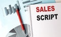 SALES SCRIPT text on a notebook with pen on a chart background