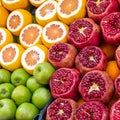 Sales stand for juice of apples, oranges and pomegranates with sliced fruits. Royalty Free Stock Photo