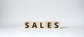Sales symbol. Concept word Sales on wooden cubes. Beautiful white background. Business and Sales concept. Copy space Royalty Free Stock Photo