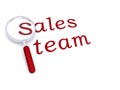 Sales team with magnifying glass