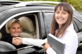 Saleslady shaking hands with a customer