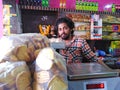 Salesman in bakery, Mandrem, Goa, India