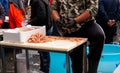 Salesman cleaning the shrimp, Catania fish market