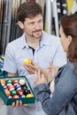 salesman and customer in snooker store Royalty Free Stock Photo