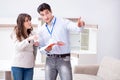 The salesman explaining to woman customer at furniture store Royalty Free Stock Photo