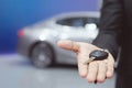 Salesman handing over gives businessman the car key Royalty Free Stock Photo