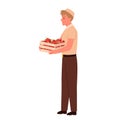 Salesman holding wooden box with vegetables, supermarket or grocery store worker selling