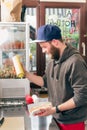 Salesman making hotdog in fast food snack bar Royalty Free Stock Photo