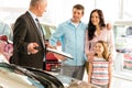 Salesman offering a car to family