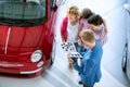 Salesman offering a car to family Royalty Free Stock Photo