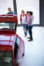 Salesman offering a car to family Royalty Free Stock Photo