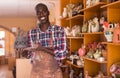 Salesman offering handmade ceramic goods