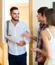 Salesman presents his project standing near the entrance door Royalty Free Stock Photo