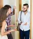 Salesman presents his project standing near the entrance door Royalty Free Stock Photo