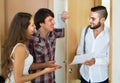 Salesman presents his project standing near the entrance door Royalty Free Stock Photo